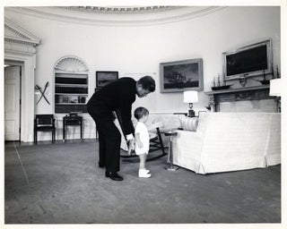 Item #297624 [PHOTOGRAPHS] TWO PRESS PHOTOGRAPHS. KENNEDY IN THE OVAL OFFICE. President John F....